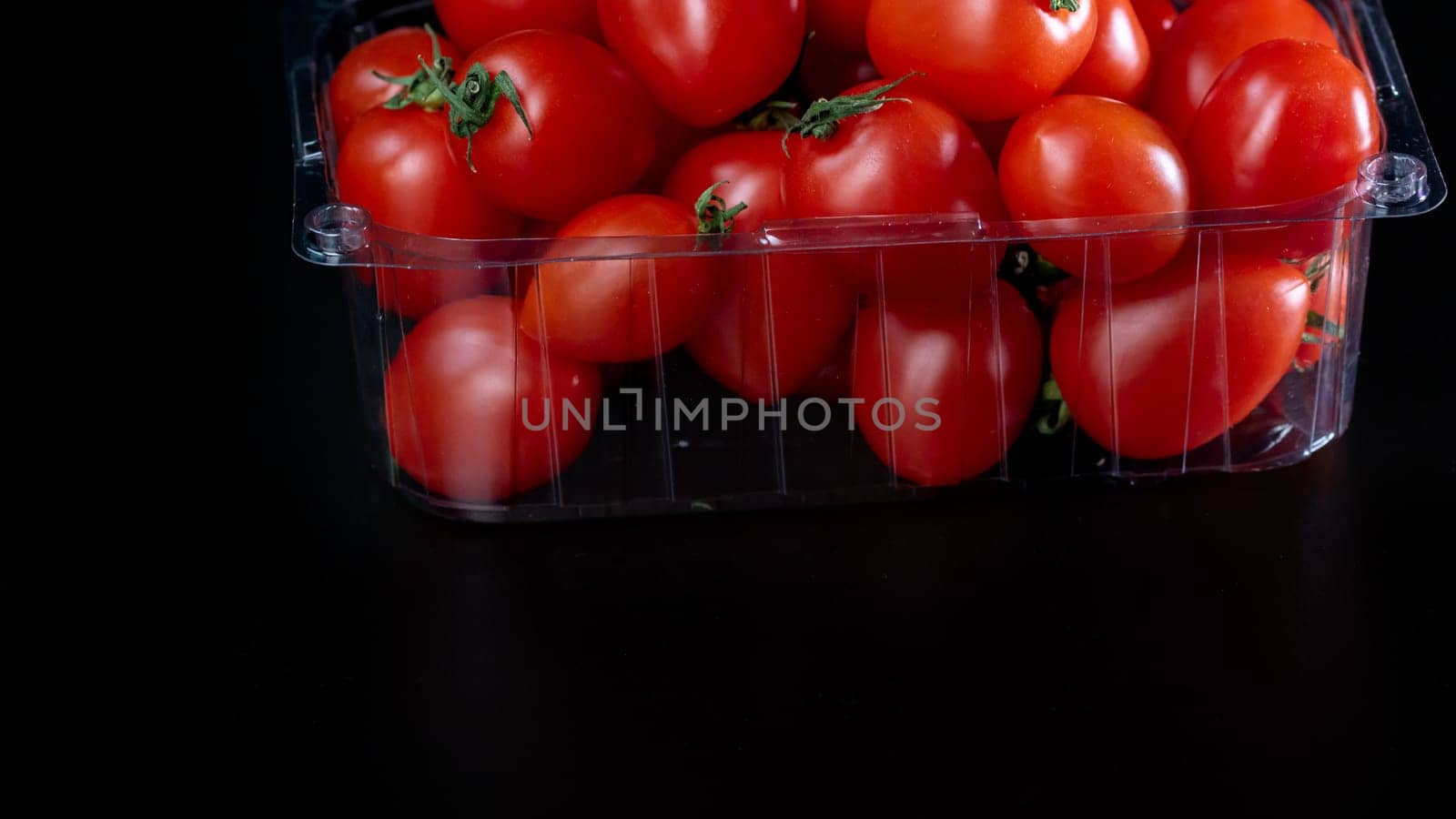 Selective focus on ripe delicious cherry tomatoes, close up by vladispas