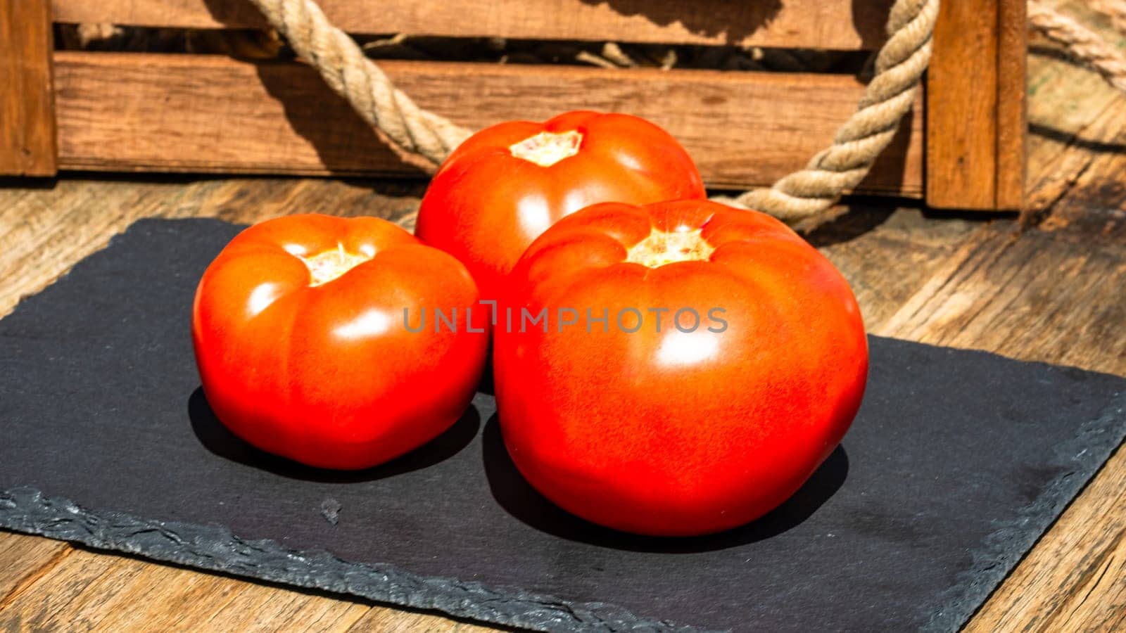 Close up of fresh ripe tomatoes isolated in a rustic composition,