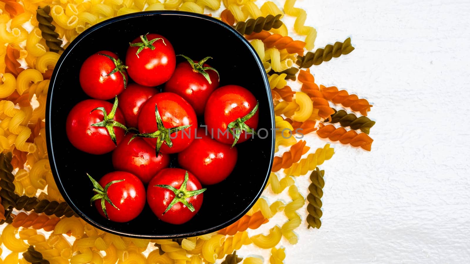 Beautiful tasty Italian pasta, tomatoes, onions and garlic for cooking pasta