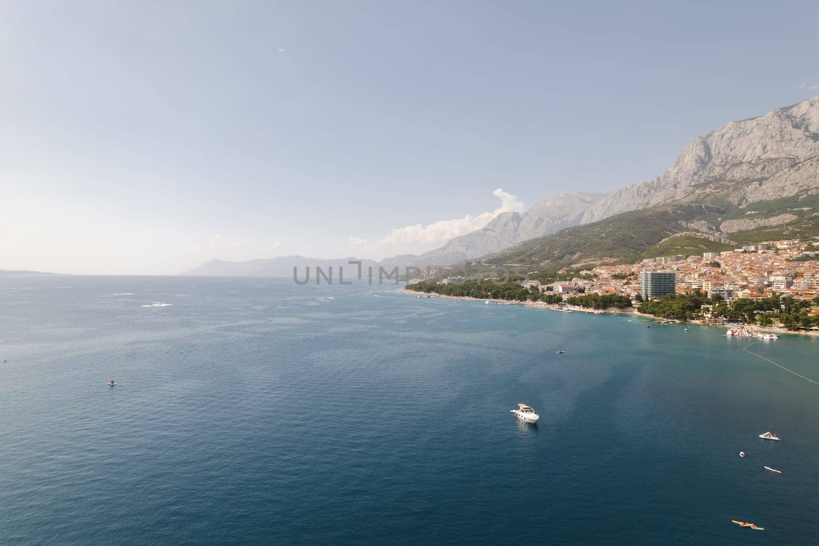 Makarska Peninsula in Croatia offers breathtaking views of Adriatic Sea. Adriatic Sea is surrounded by lush greenery, creating serene and peaceful atmosphere.