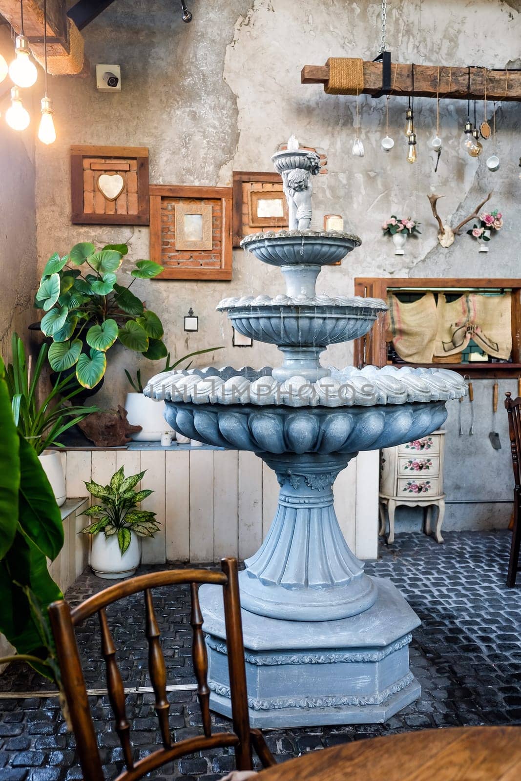 Fountain in the interior of a Vintage Dining Room The concept of rest and relaxation.