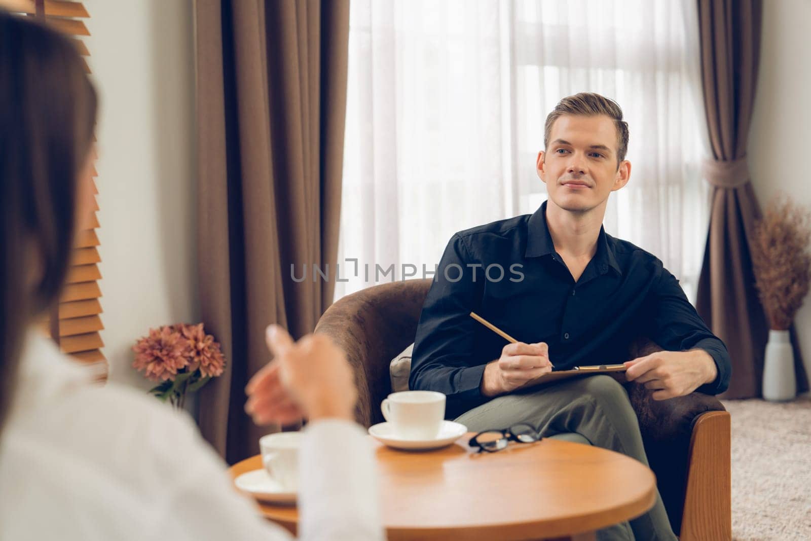 Psychological consultation gaining improvement on mental problem, happy young female patient doing therapy session while psychiatrist making diagnostic on mental illness. Unveiling