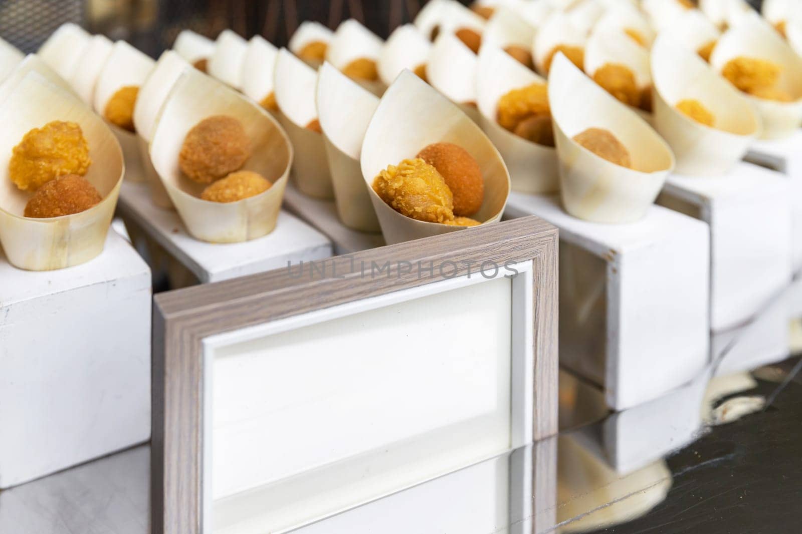 Fried Appetizers in paper cones for a party. 
Various tastes.