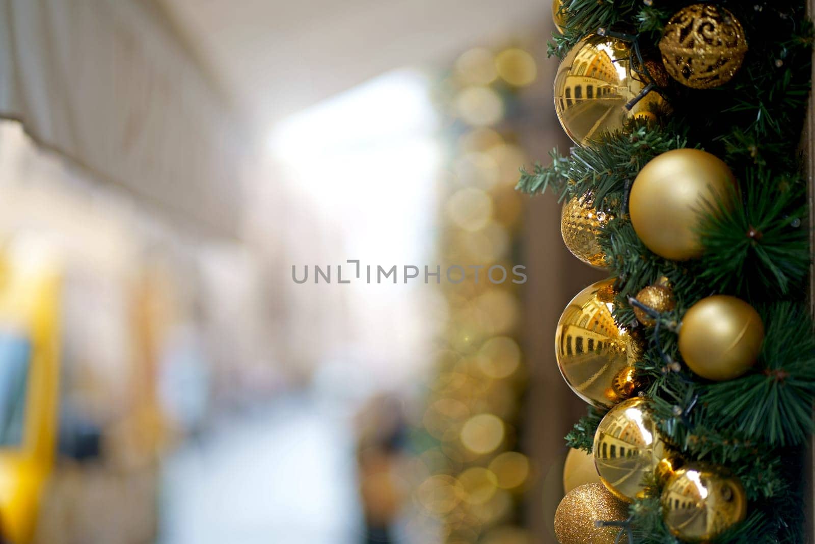 Christmas street decor. Christmas balls on tree branches on winter city streets. Soft focus. Christmas in Europe.Christmas season in Europe. Winter holiday decor by aprilphoto