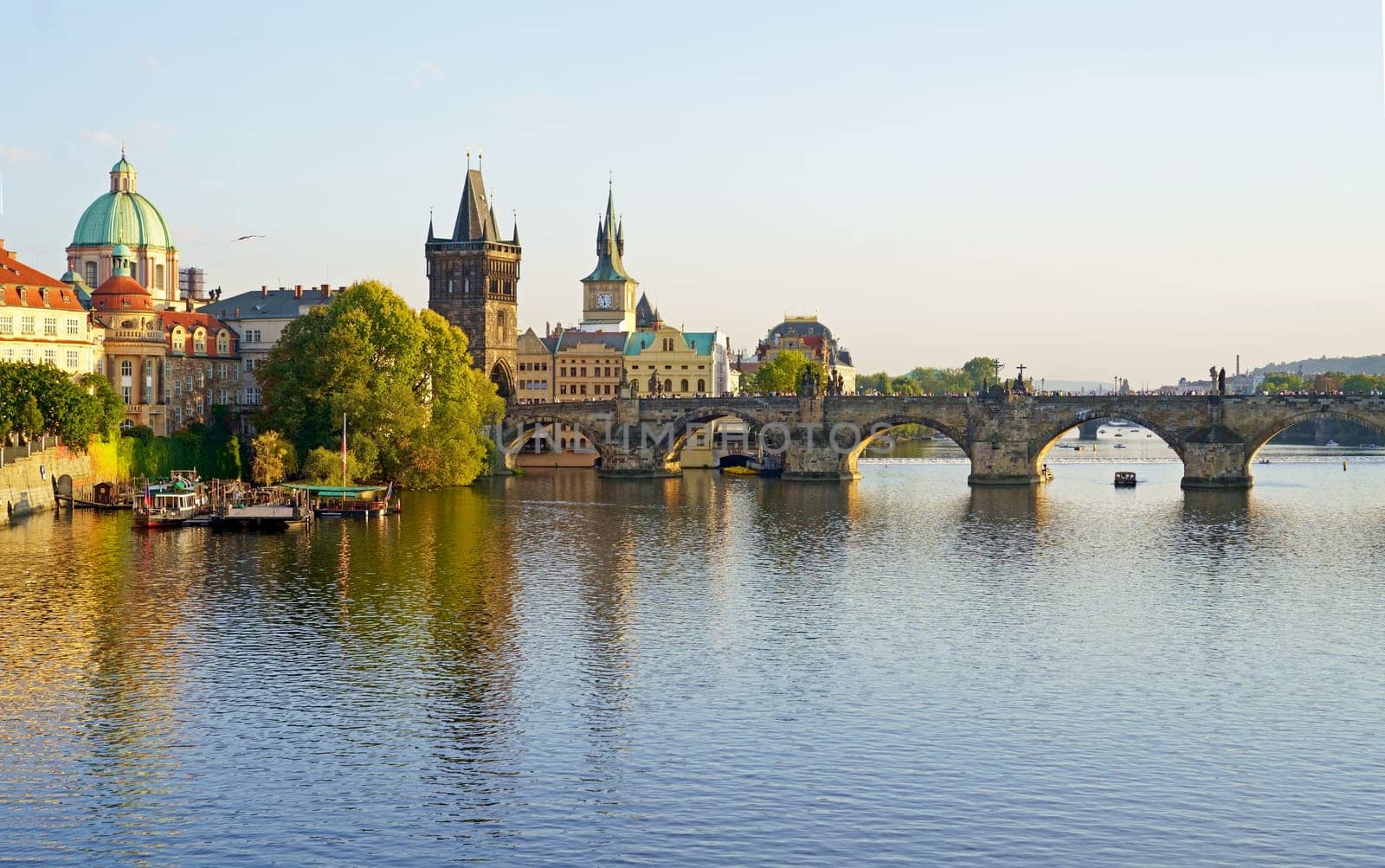 Prague - Charles bridge, Czech Republic. Scenic aerial sunset on the architecture of the Old Town Pier and Charles Bridge over the Vltava River in Prague, Czech Republic.