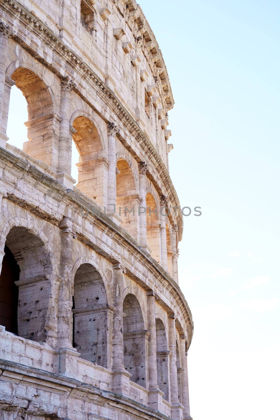 Colosseum in Rome, Italy on cloudy sky background. The Colosseum. Famous place. Historical buuilding on cloudy blue nice sky background by aprilphoto