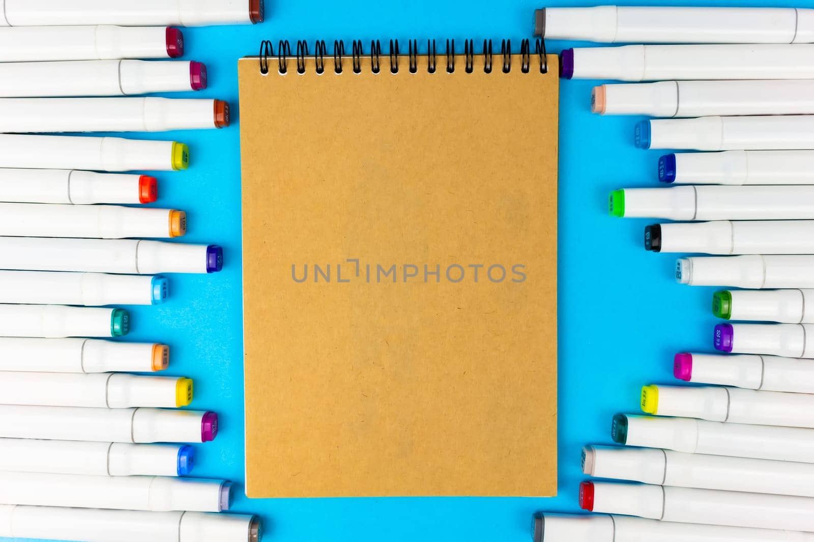 Place for writing on a yellow notepad. White markers on a blue background.
