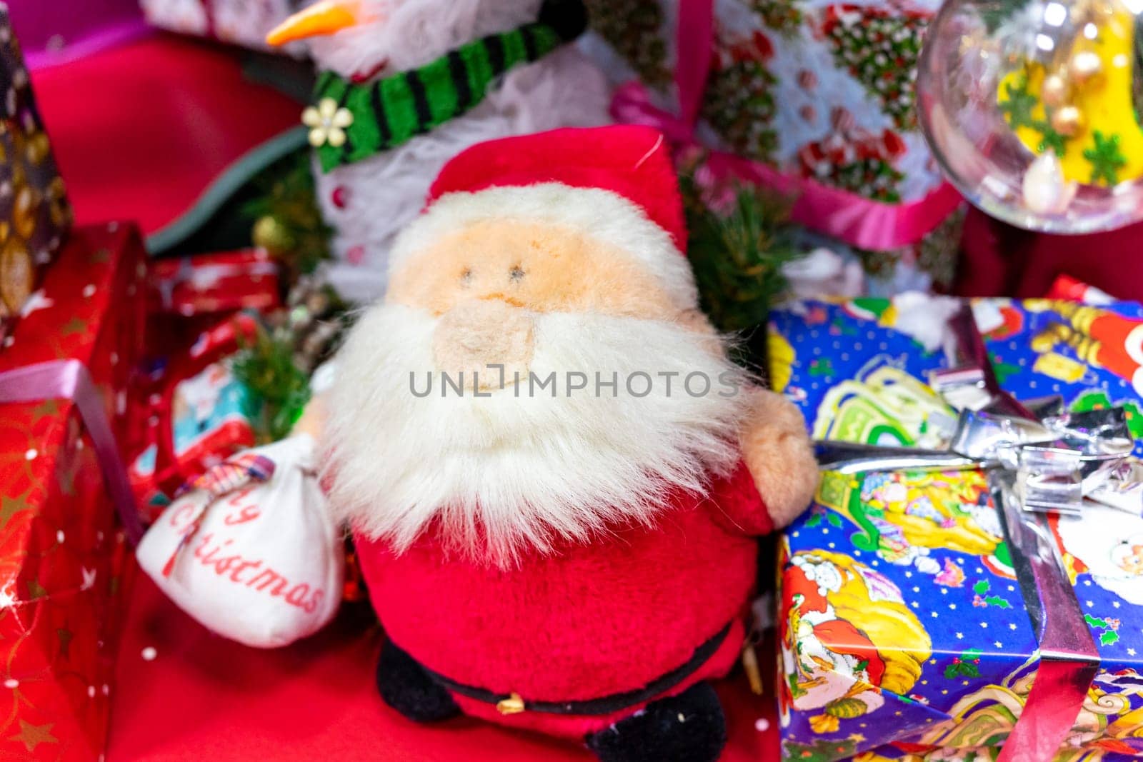 Little Santa Claus near big presents by Serhii_Voroshchuk
