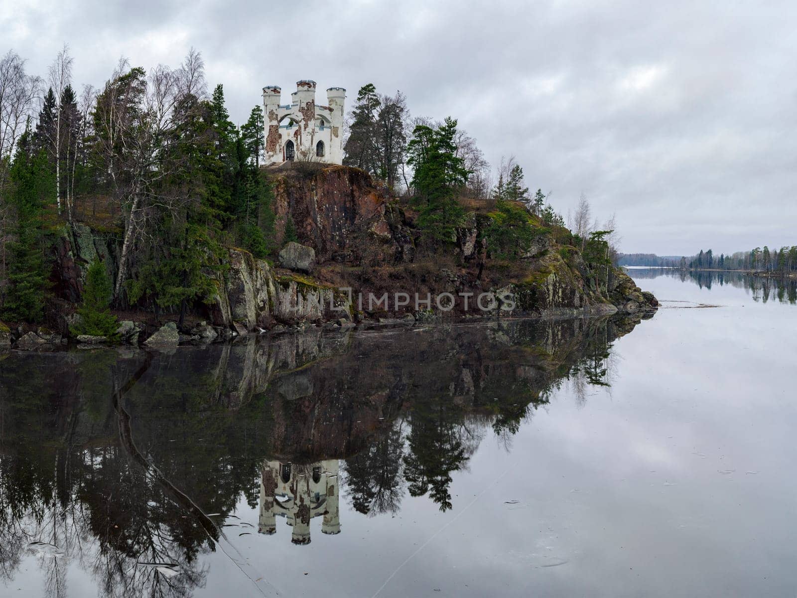 Vyborg, Russia, Leningrad Region - 17.01.2020: Isle of the Dead and the chapel of Ludwigstein may Sunny day. The old Park estate of Monrepo.