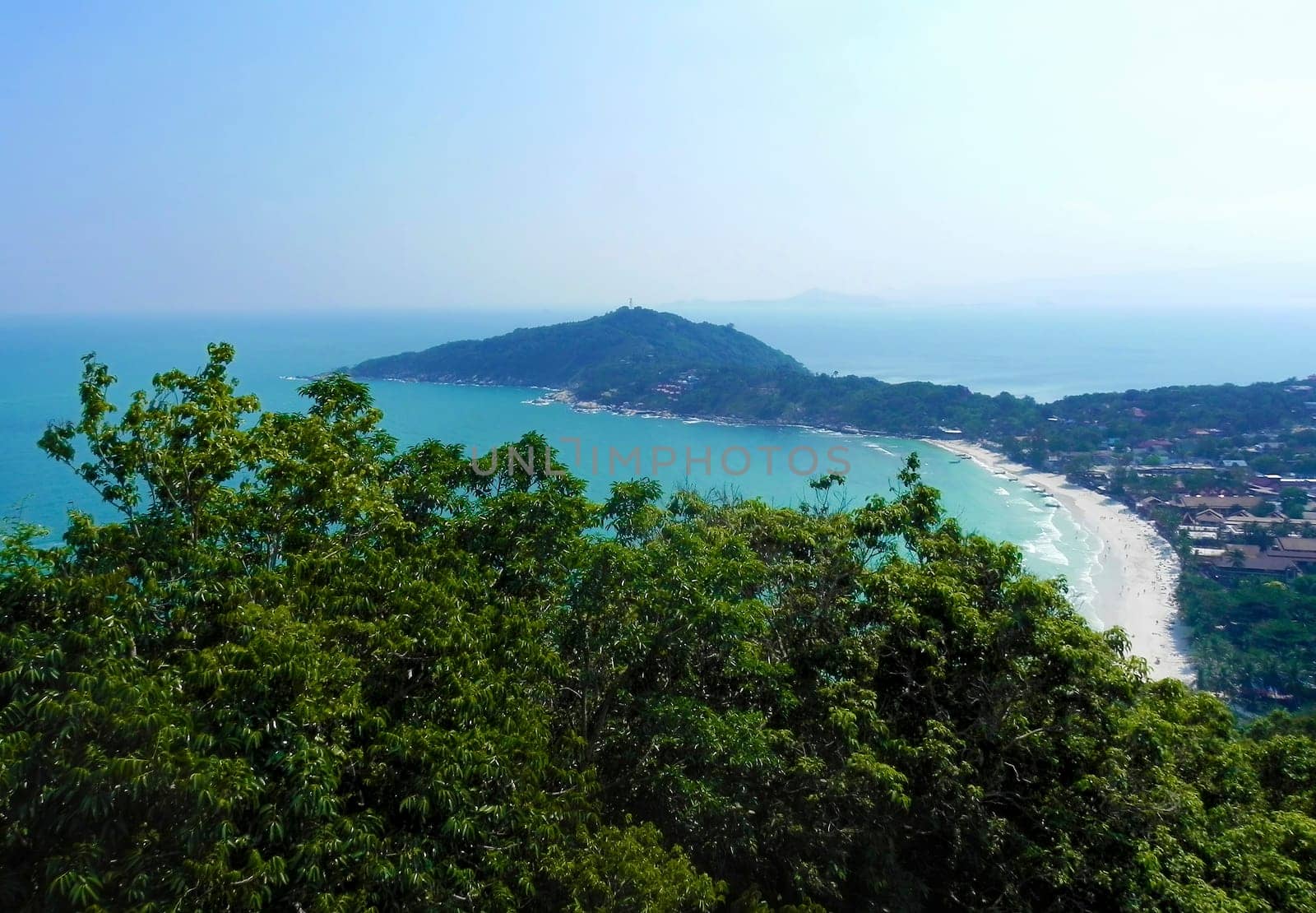 Beautiful coast with azure water cliffs and green jungle on Koh Phangan. Thailand