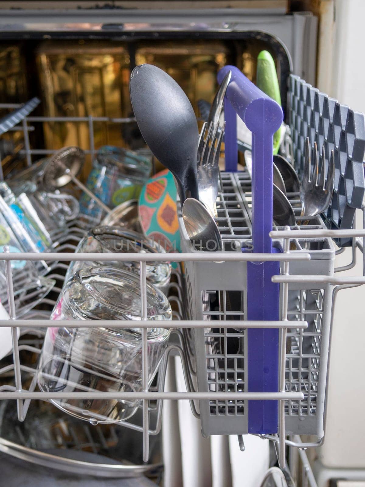 Open dishwasher with clean dishes