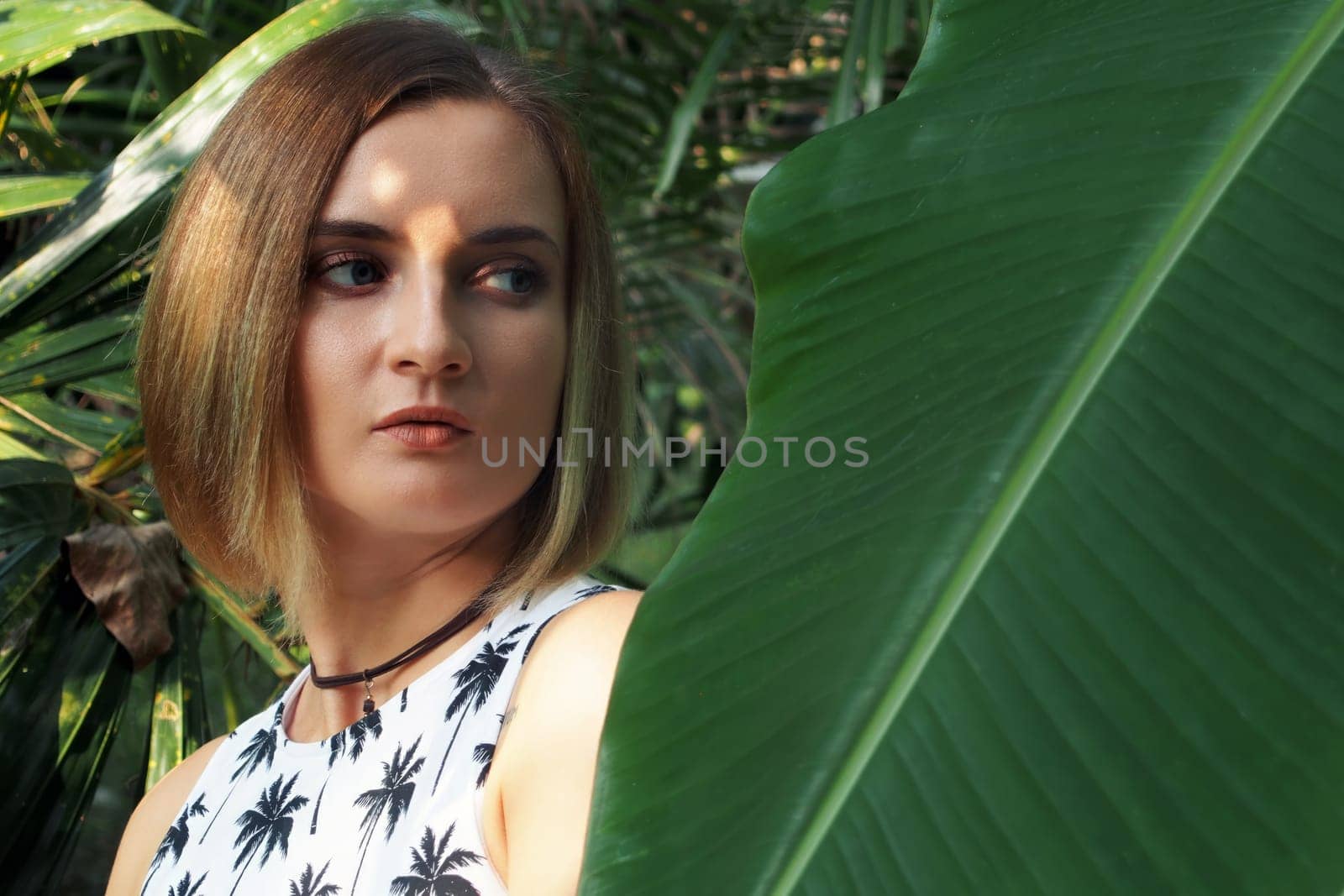 Girl in the jungle. Young beautiful european girl in the tropical jungle
