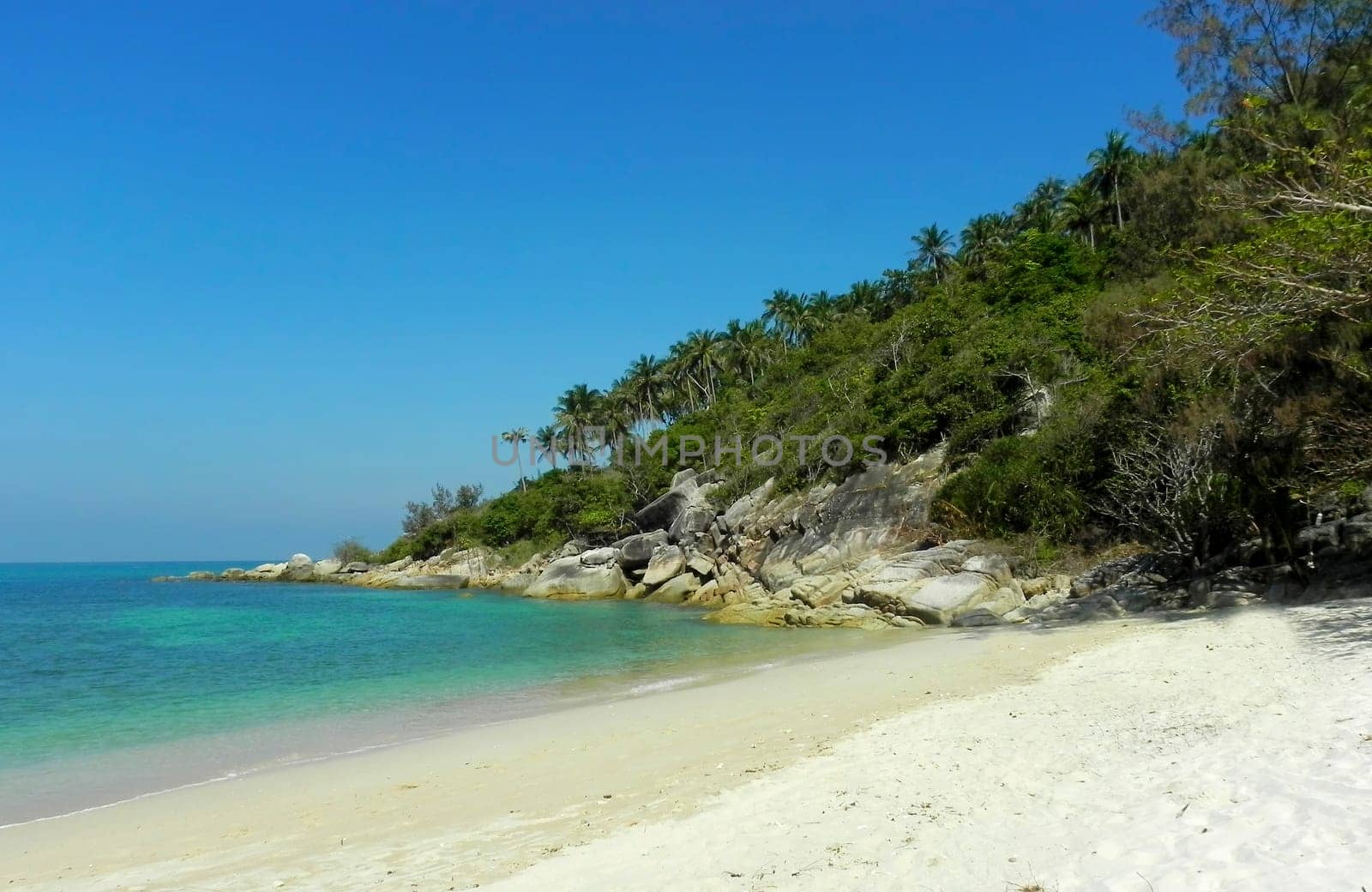 Beautiful coast with azure water cliffs and green jungle on Koh Phangan. Thailand