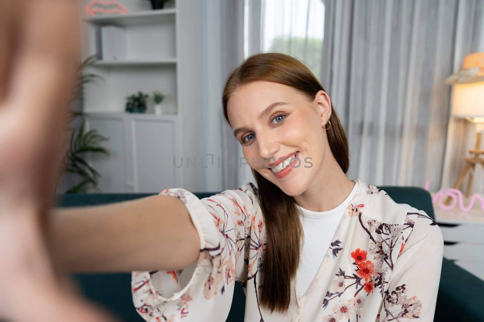 Woman influencer shoot live streaming vlog video review makeup utmost social media or blog. Happy young girl with cosmetics studio lighting for marketing recording session broadcasting online.