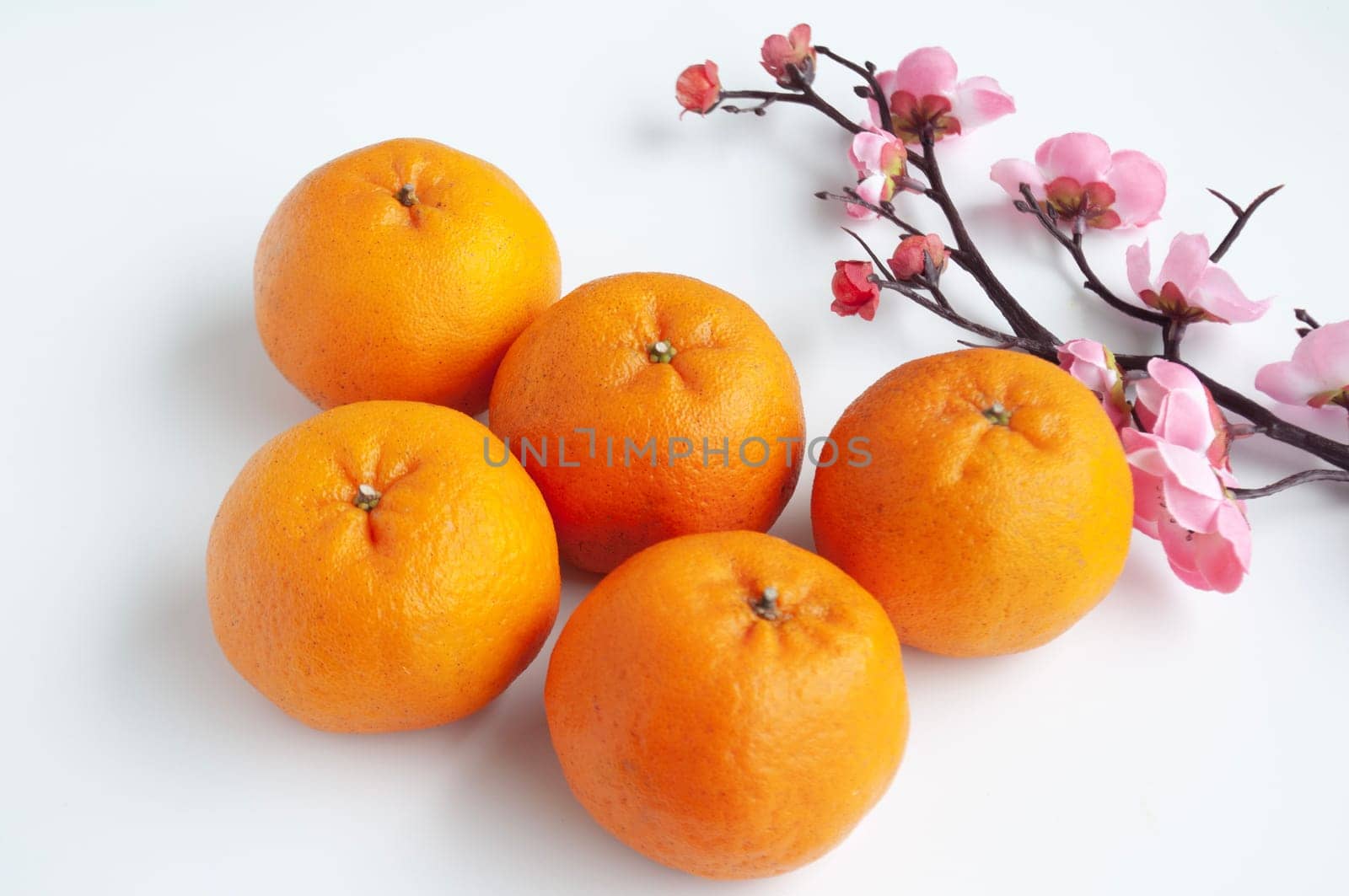 Top view of Mandarin oranges on white cover background. Chinese New Year celebration.