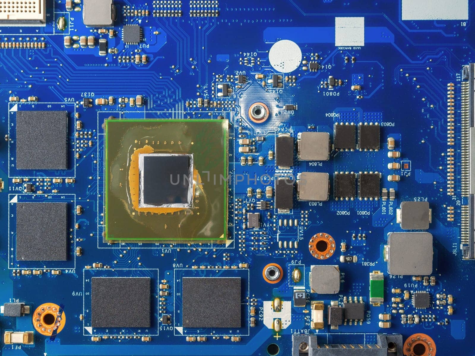 Close up of a printed blue computer circuit board