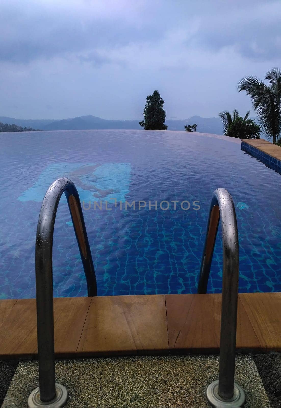 Hotel swimming pool with sunny reflections