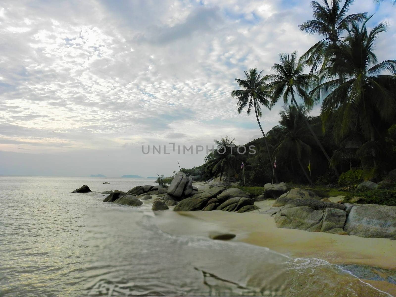 Beautiful coast with azure water cliffs and green jungle on Koh Phangan. Thailand