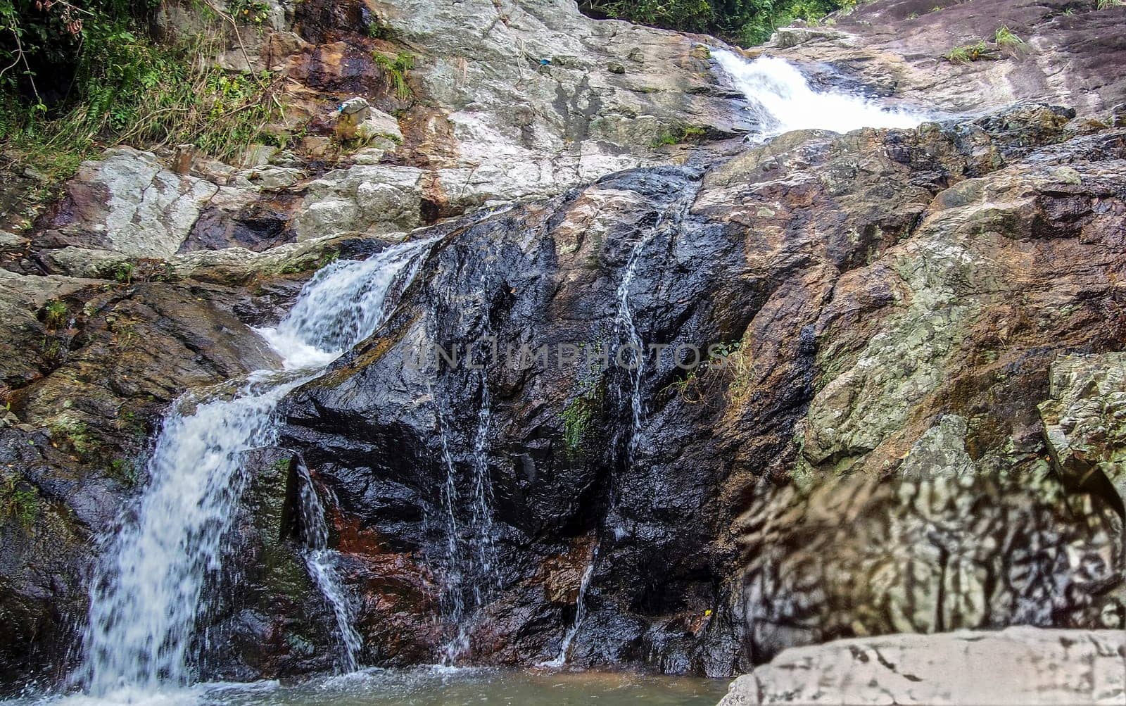 Motion Blur Waterfalls Peaceful Nature Landscape in Blue Ridge Mountains with lush green trees, rocks and flowing water