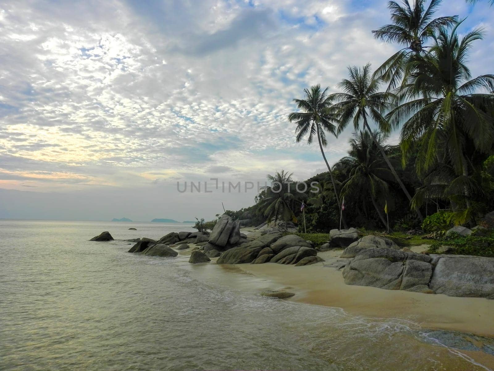Beautiful coast with azure water cliffs and green jungle on Koh Phangan. Thailand