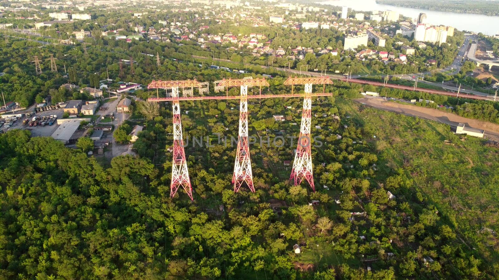 High voltage post. Three High voltage towers. Group of transmission towers or power tower, electricity pylon, steel lattice tower. Aerial view