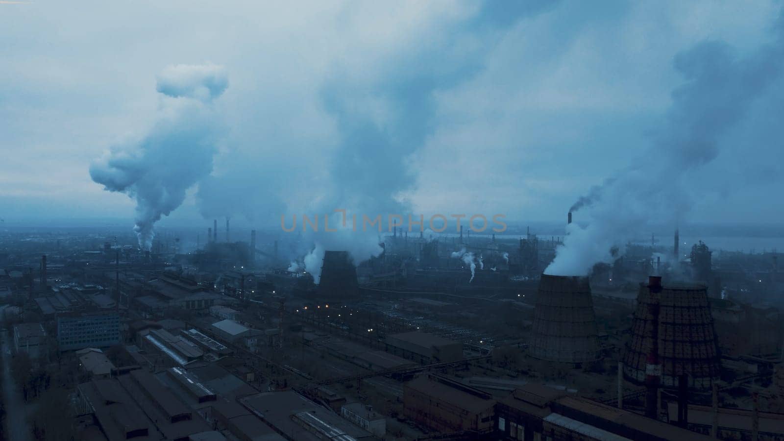 Smoke coming from industrial waste. using new technology to clean it before dispersing. Industrial panoramic landmark, blast furnance of metallurgical production. Concept of environmental pollution by igor010