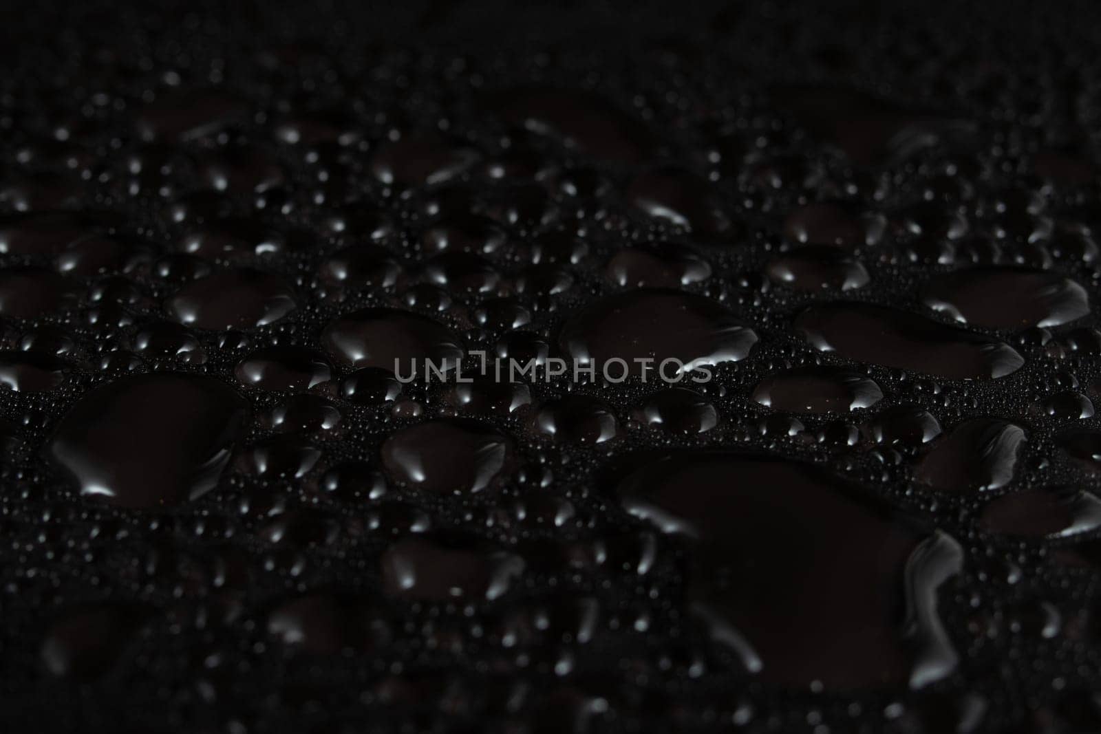 Water drops on black background