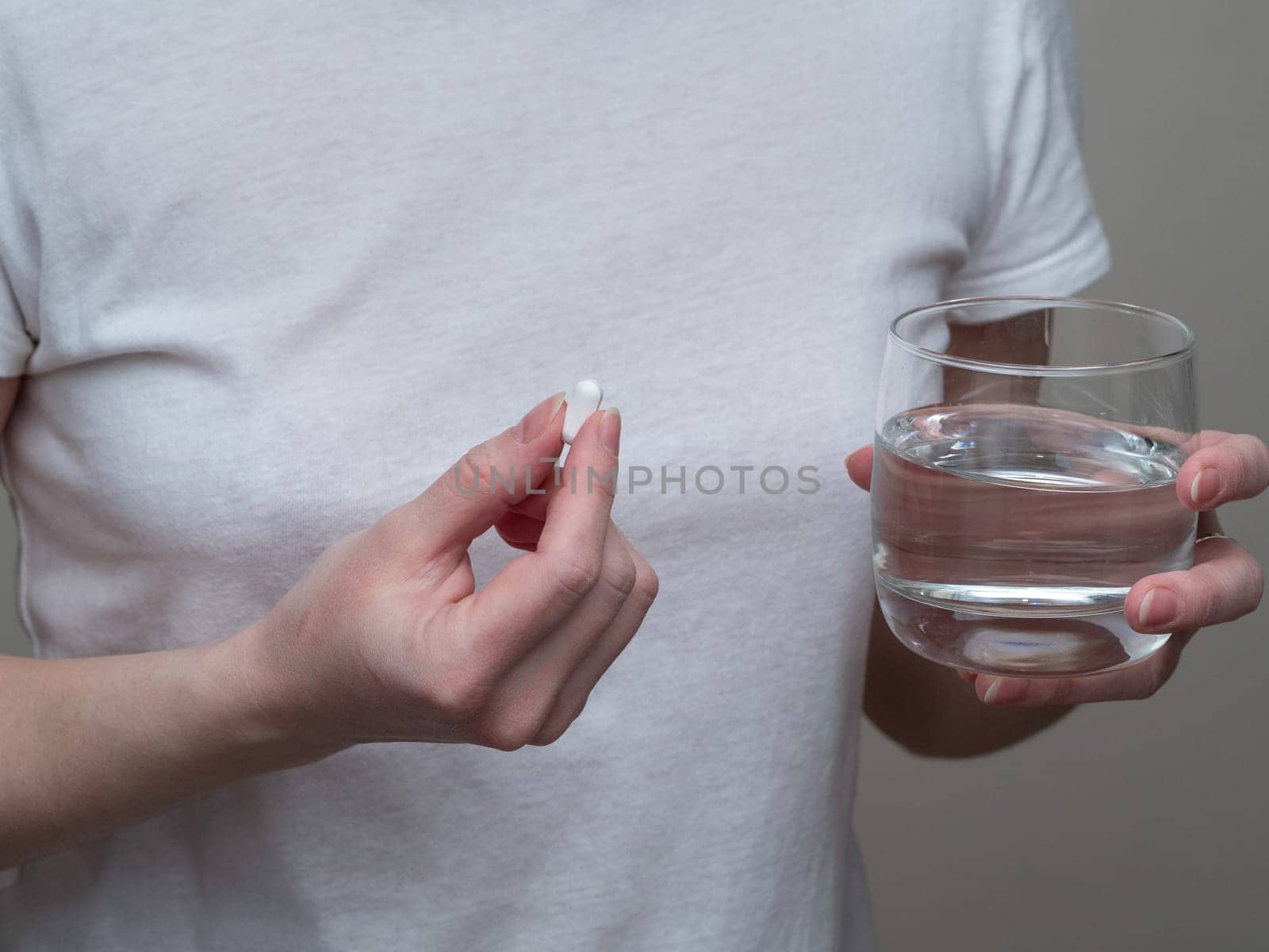 Close up of woman taking in pill, Medicine, health care and people concept