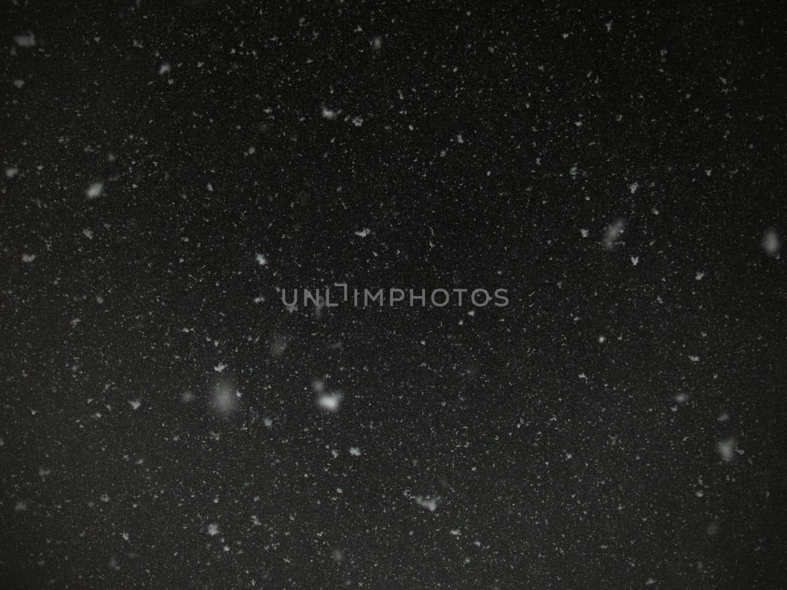 abstract texture with snow falling
