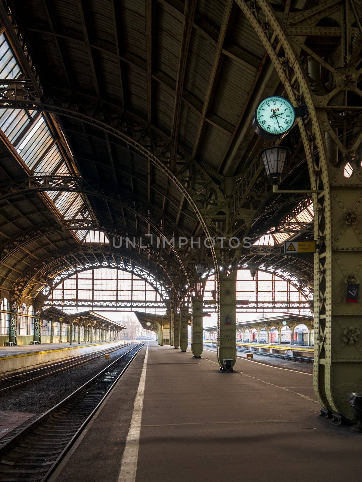 St. Petersburg, Vitebsk railway station in an early sunny morning, platform with a clock by Andre1ns
