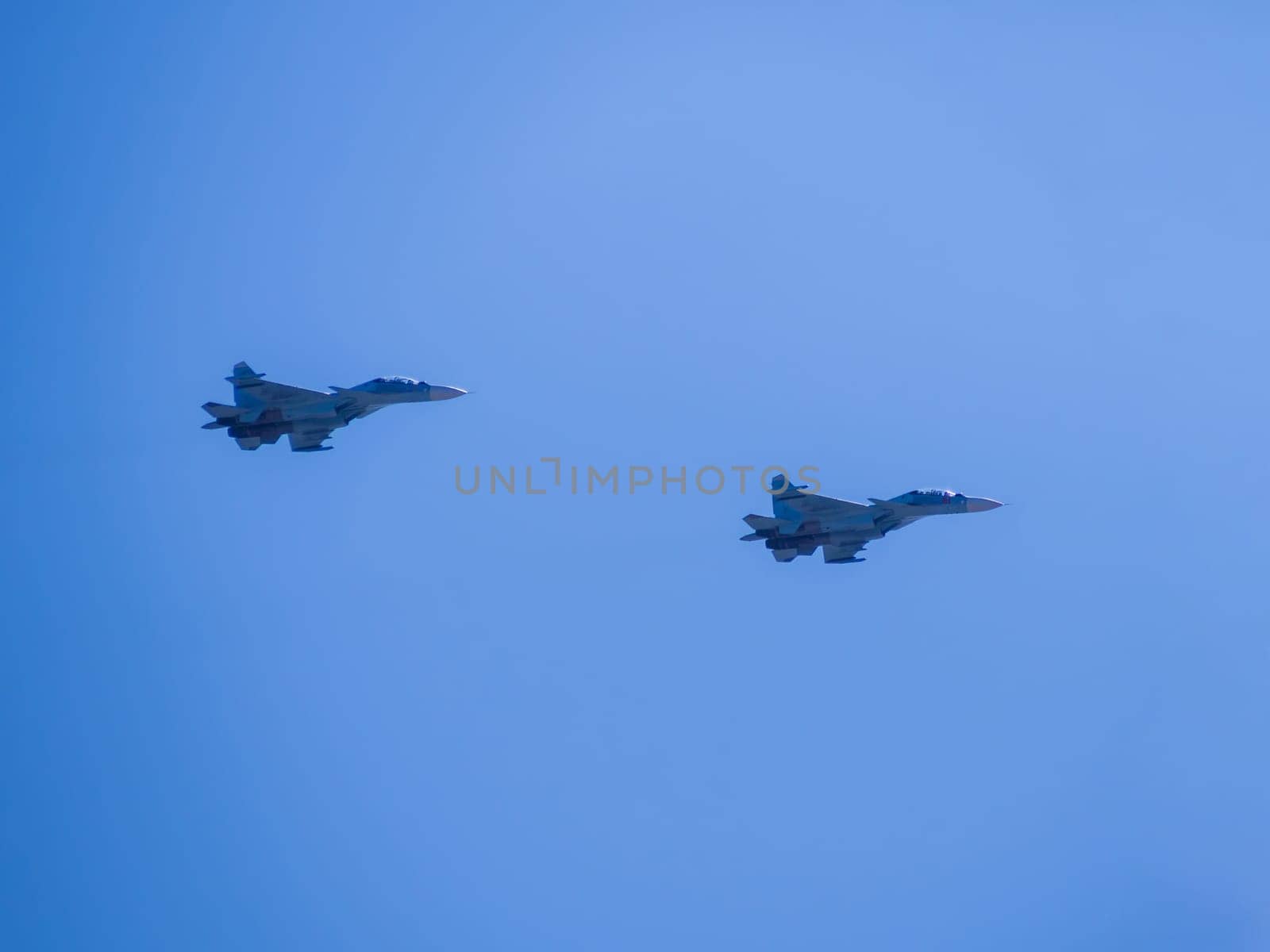 Russia, St. Petersburg - June 24, 2020: Demonstration flight of two Russian-made su-30SM multirole fighters. Russian military su-30SM plane of the Russian Air Force in flight at the Victory Parade in World War II.