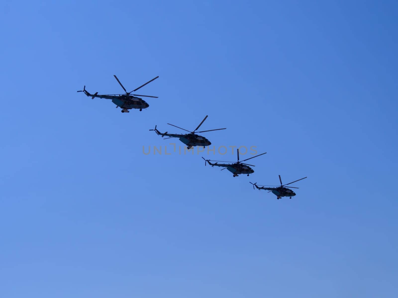 Russia, St. Petersburg - June 24, 2020: Russian military helicopters Mi-8 of the Russian Air Force in flight at the Victory Parade in World War II.