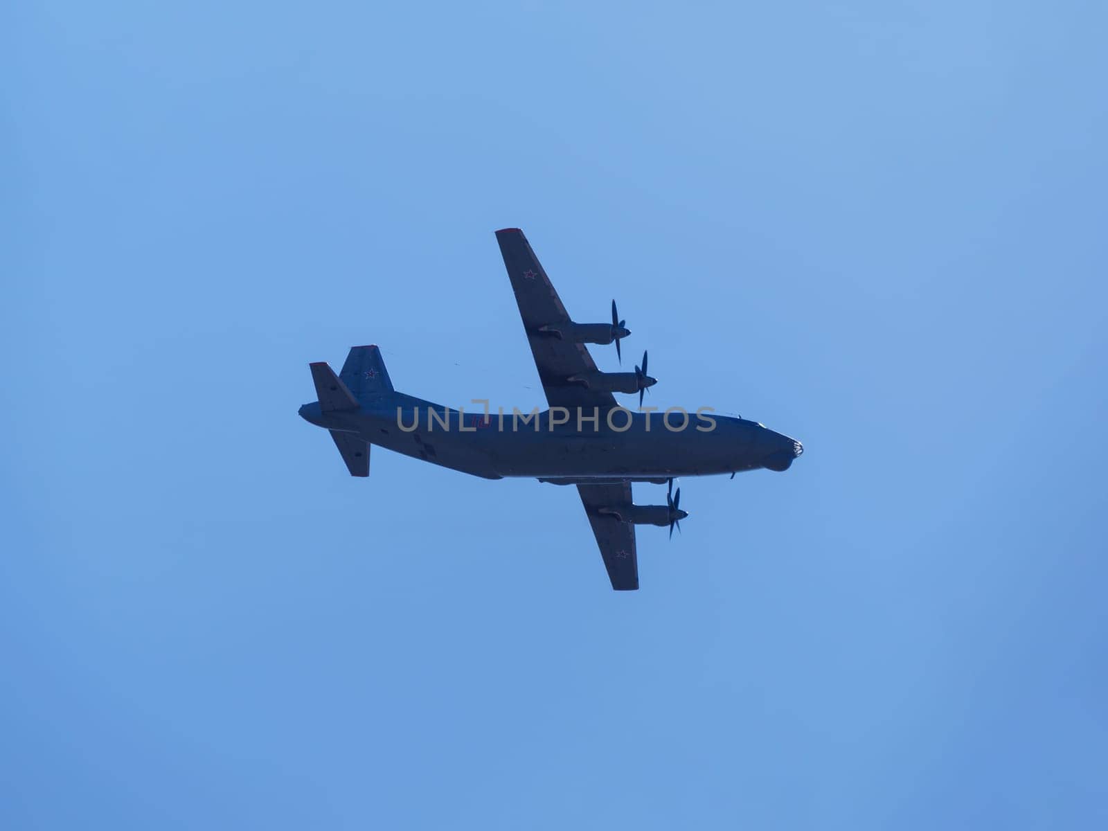 Russia, St. Petersburg - June 24, 2020: Russian military an-12 plane of the Russian Air Force in flight at the Victory Parade in World War II.