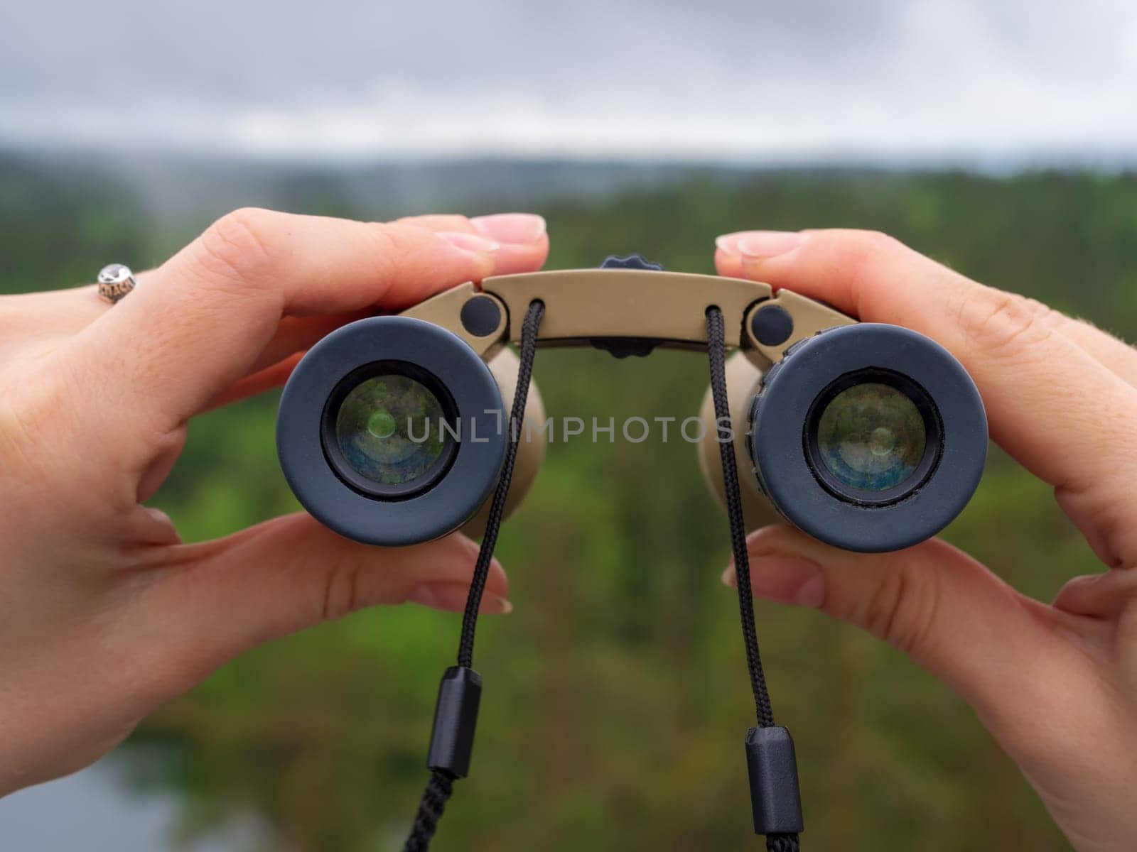 Binoculars in hands, looking through binoculars by Andre1ns