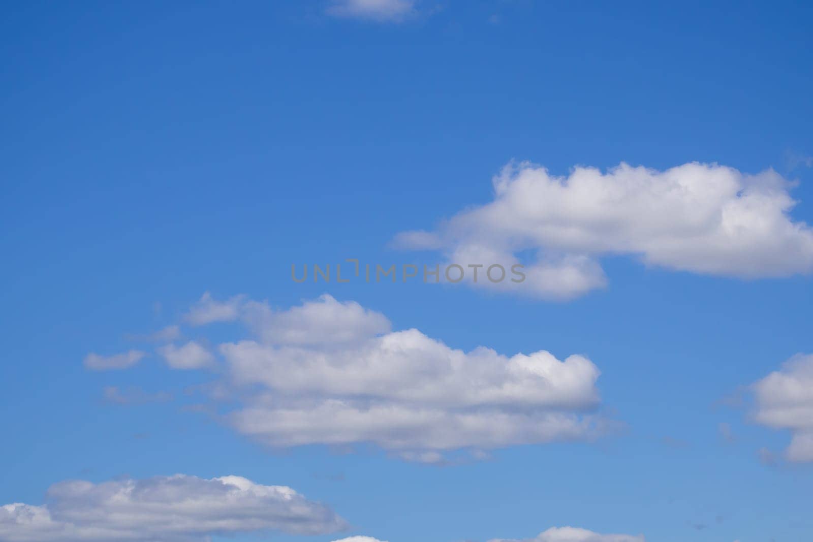 white fluffy clouds in the blue sky