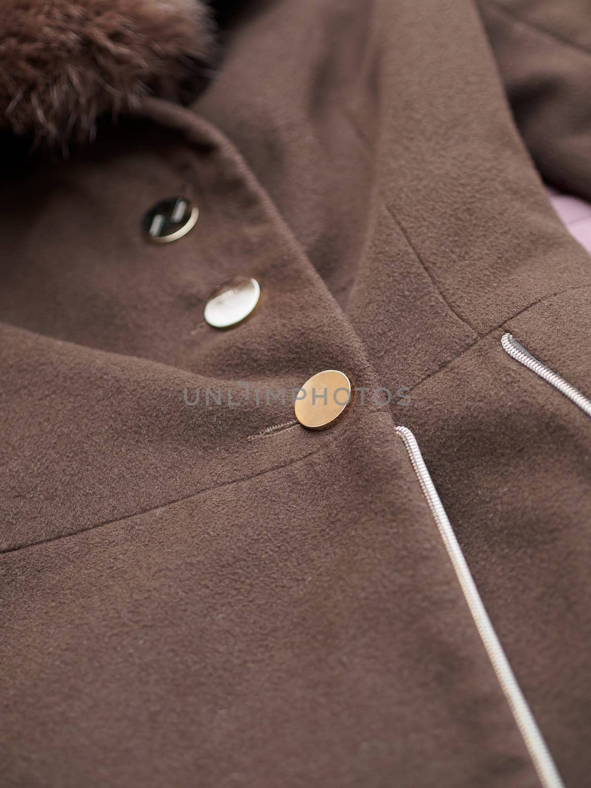Close up of fashionable mens brown coat combined with brown fashionable sweater. Low DOF. by Andre1ns