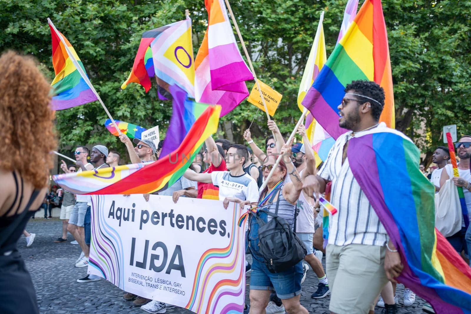 Lisbon, Portugal. 17 June 2023: LGBTQ activists with banners at Pride Parade by andreonegin