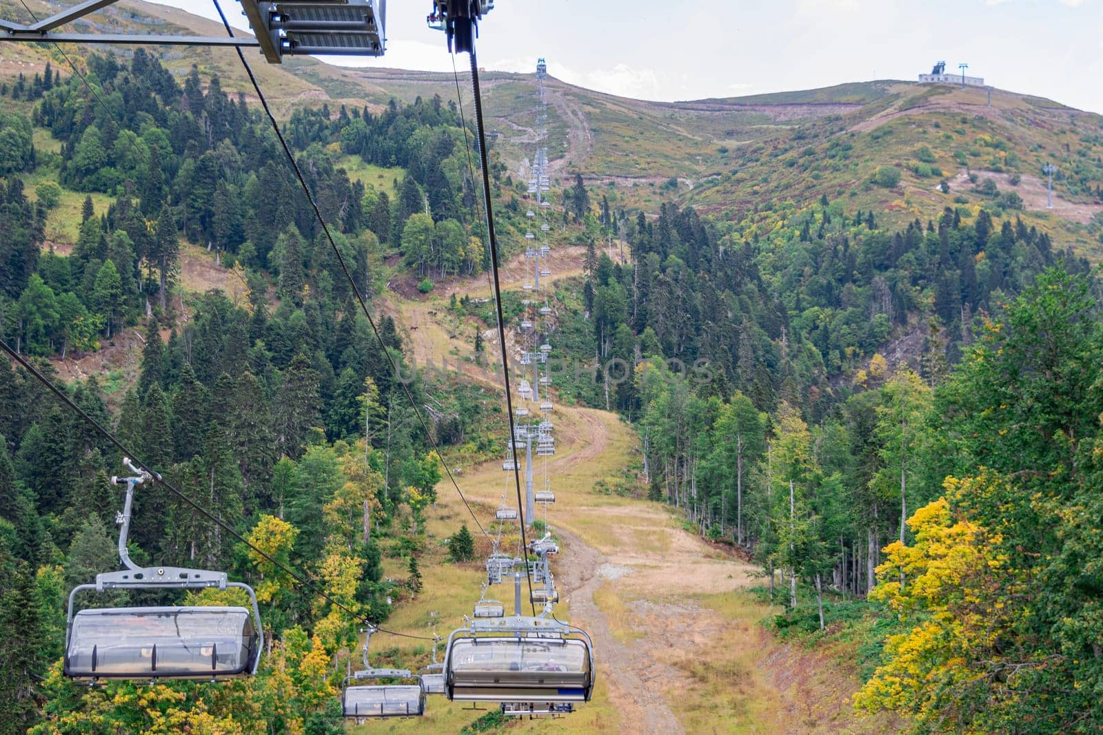 lifts of the mountain cable car on the background of mountains by roman112007