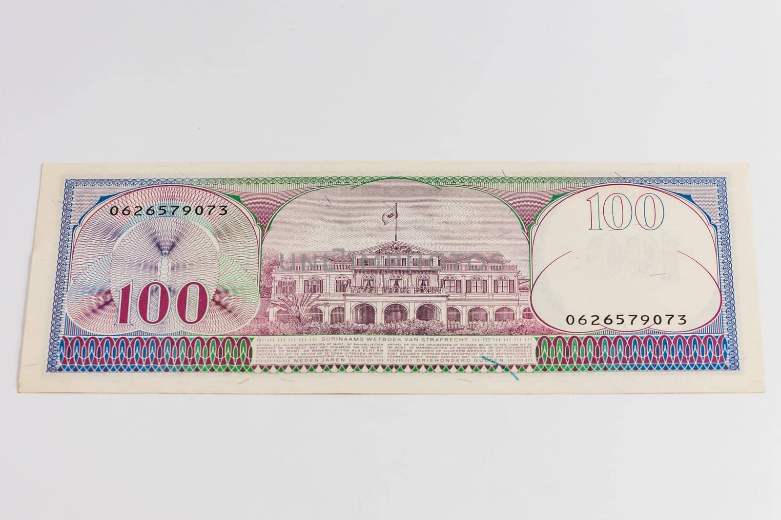 Old Suriname banknote of 100 Gulden from 1985 year 