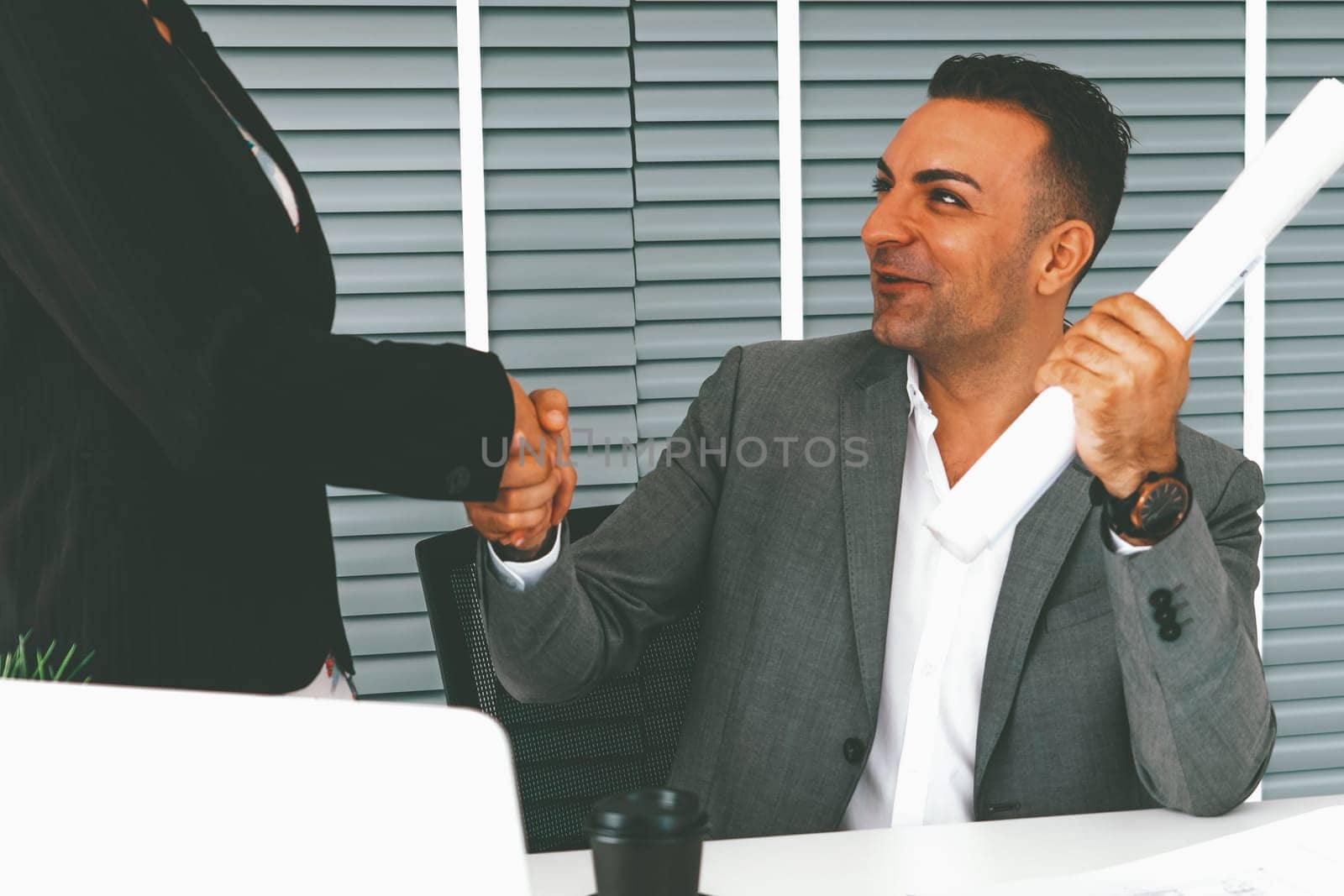 Businessman executive handshake with businesswoman worker in modern workplace office. People corporate business deals concept. uds