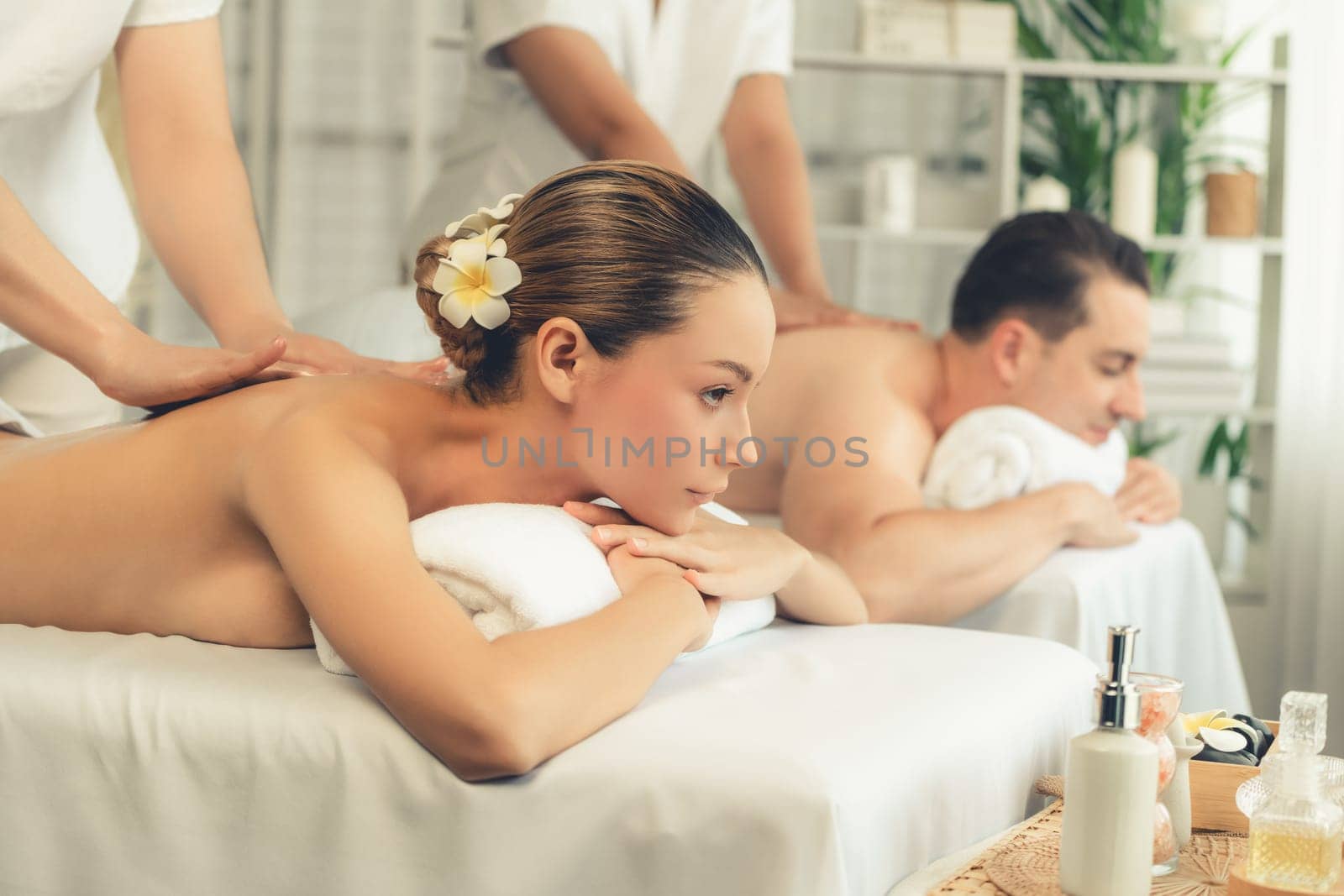 Caucasian couple customer enjoying relaxing anti-stress massage. Quiescent by biancoblue