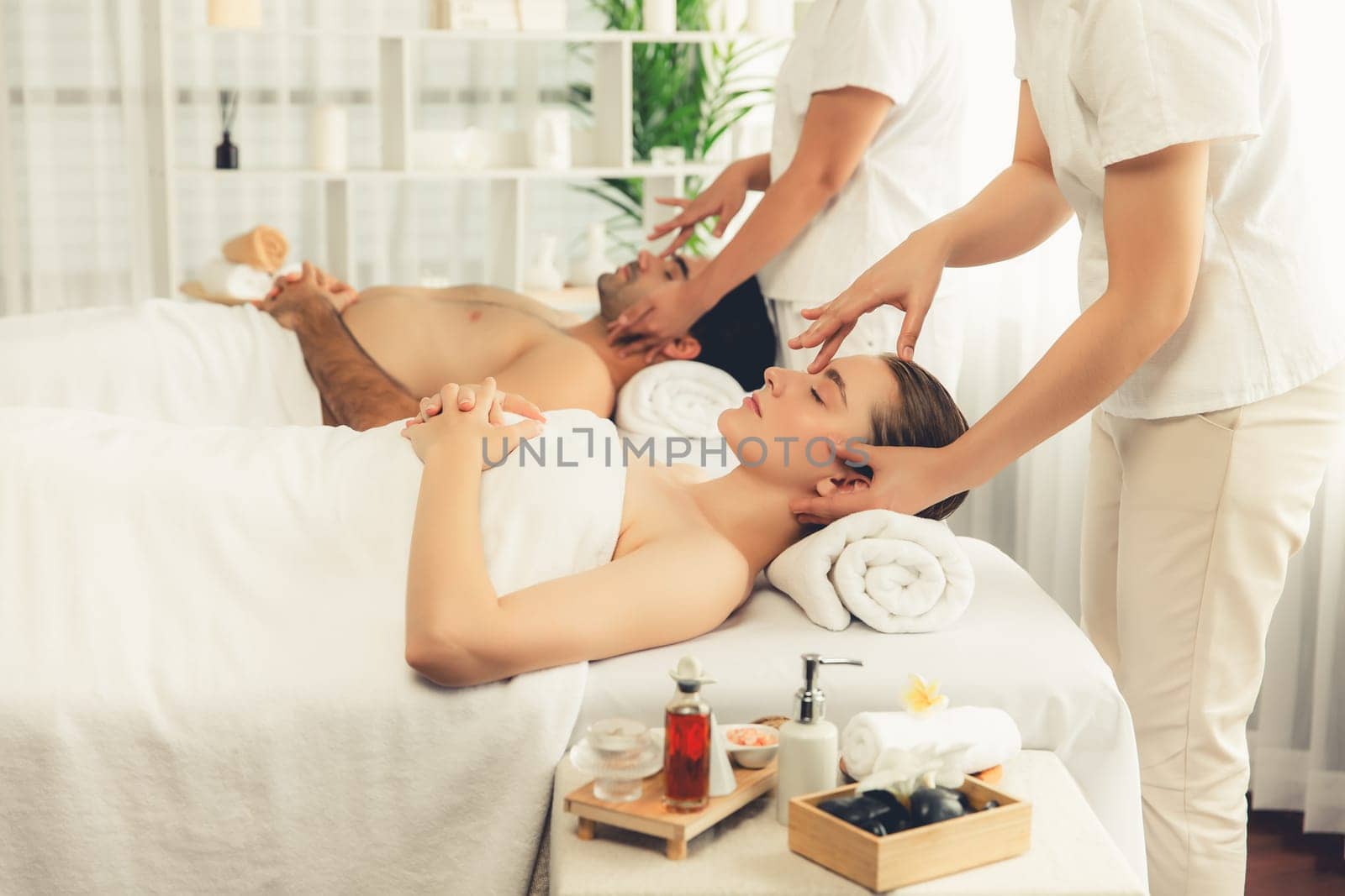 Caucasian couple enjoying relaxing anti-stress head massage. Quiescent by biancoblue