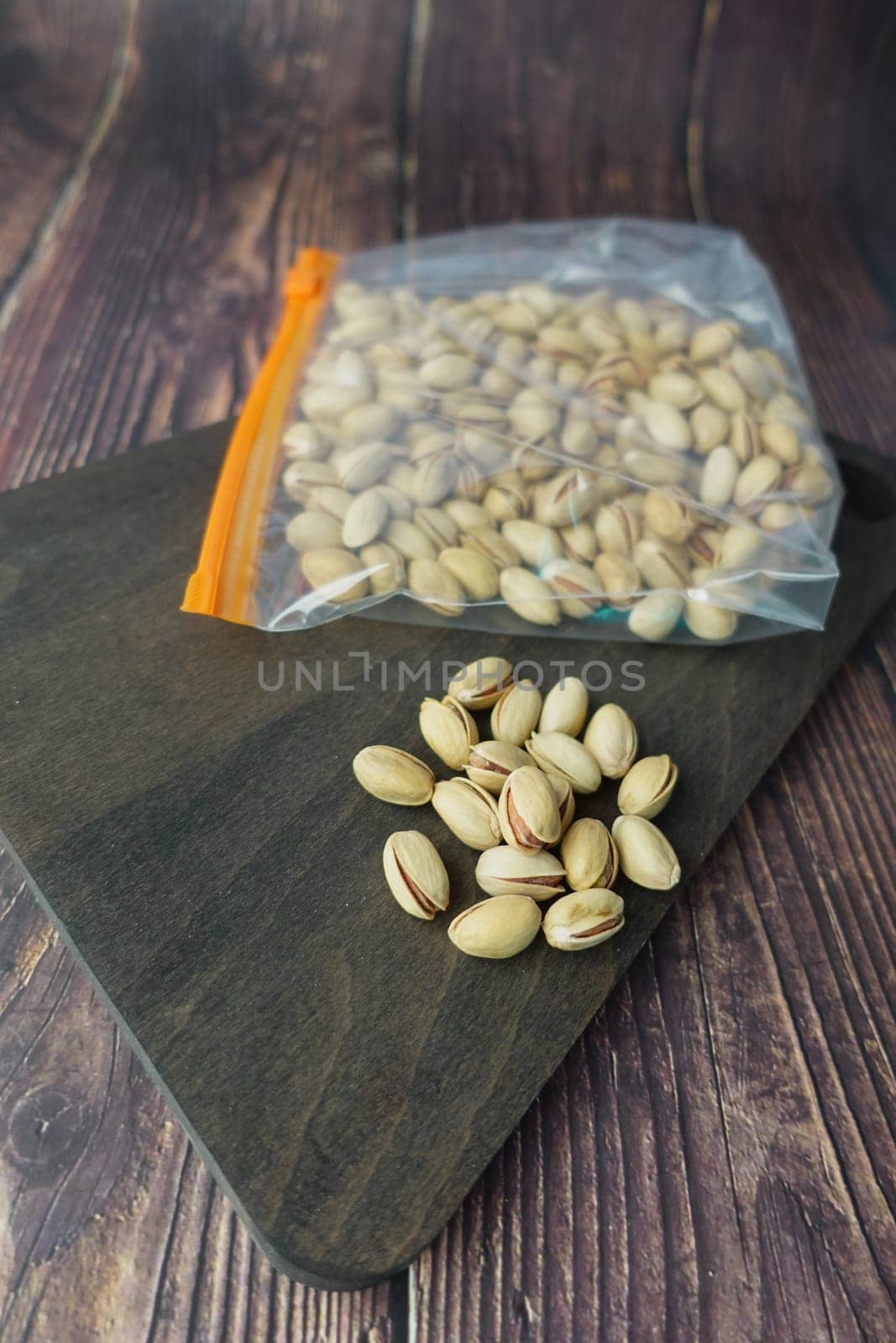close up of pistachios nuts in a plastic packet ,