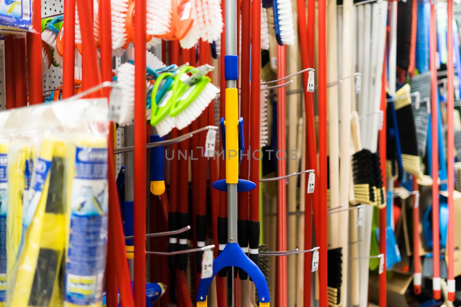 Large assortment of brushes for cleaning premises in the store. Trade in floor cleaning equipment by Zelenin