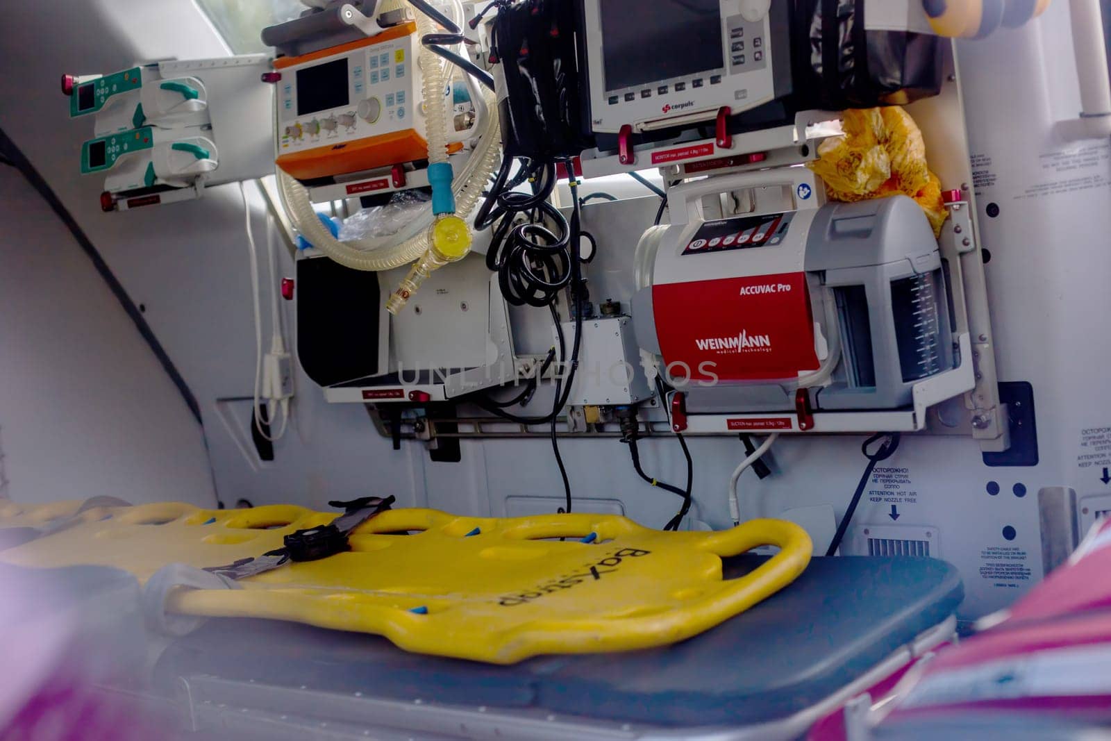 Moscow, Moscow region, Russia - 03.09.2023:An inside view of an ambulance helicopter with modern life support devices and a yellow spinal platform