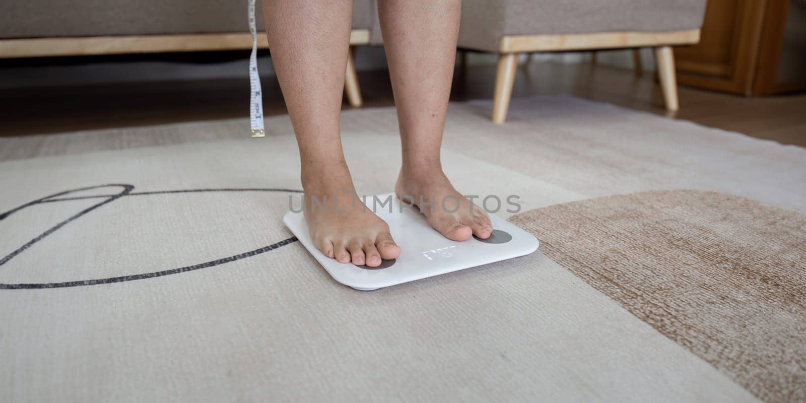 Over weight women weigh on scales to see results after exercise, healthy at home.