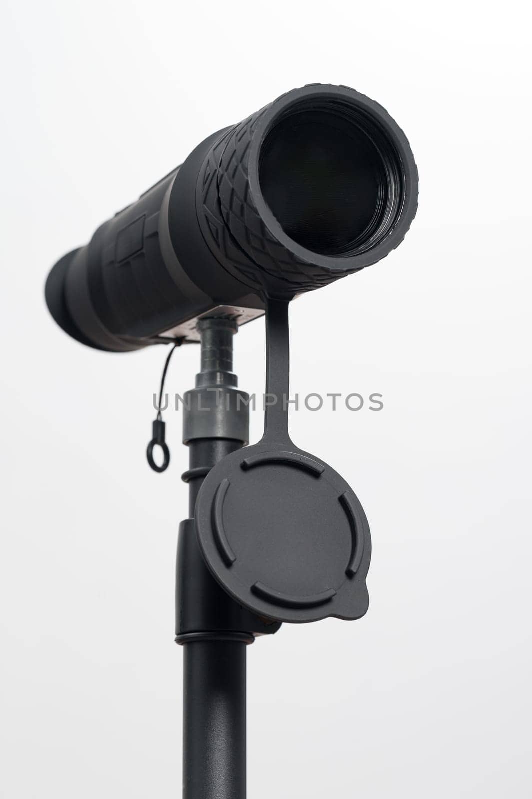 Monocular on a tripod isolated on a white background, monocular for military action.