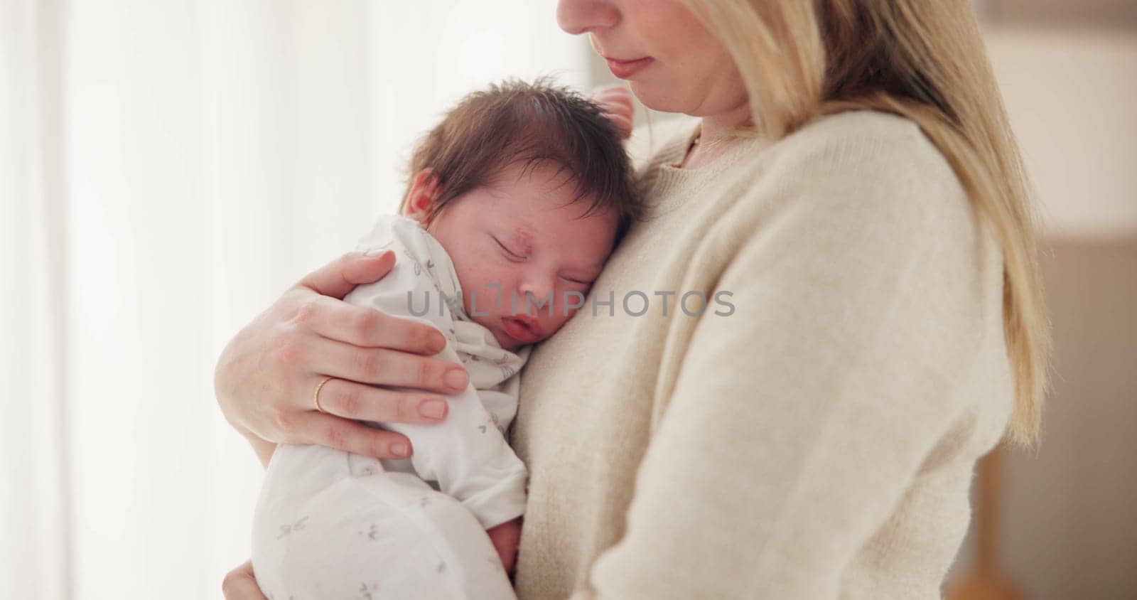 Family, sleeping and mother with baby in home for bonding, relationship and child development together. Newborn, motherhood and mom carrying infant for care, support and dreaming in nursery room.
