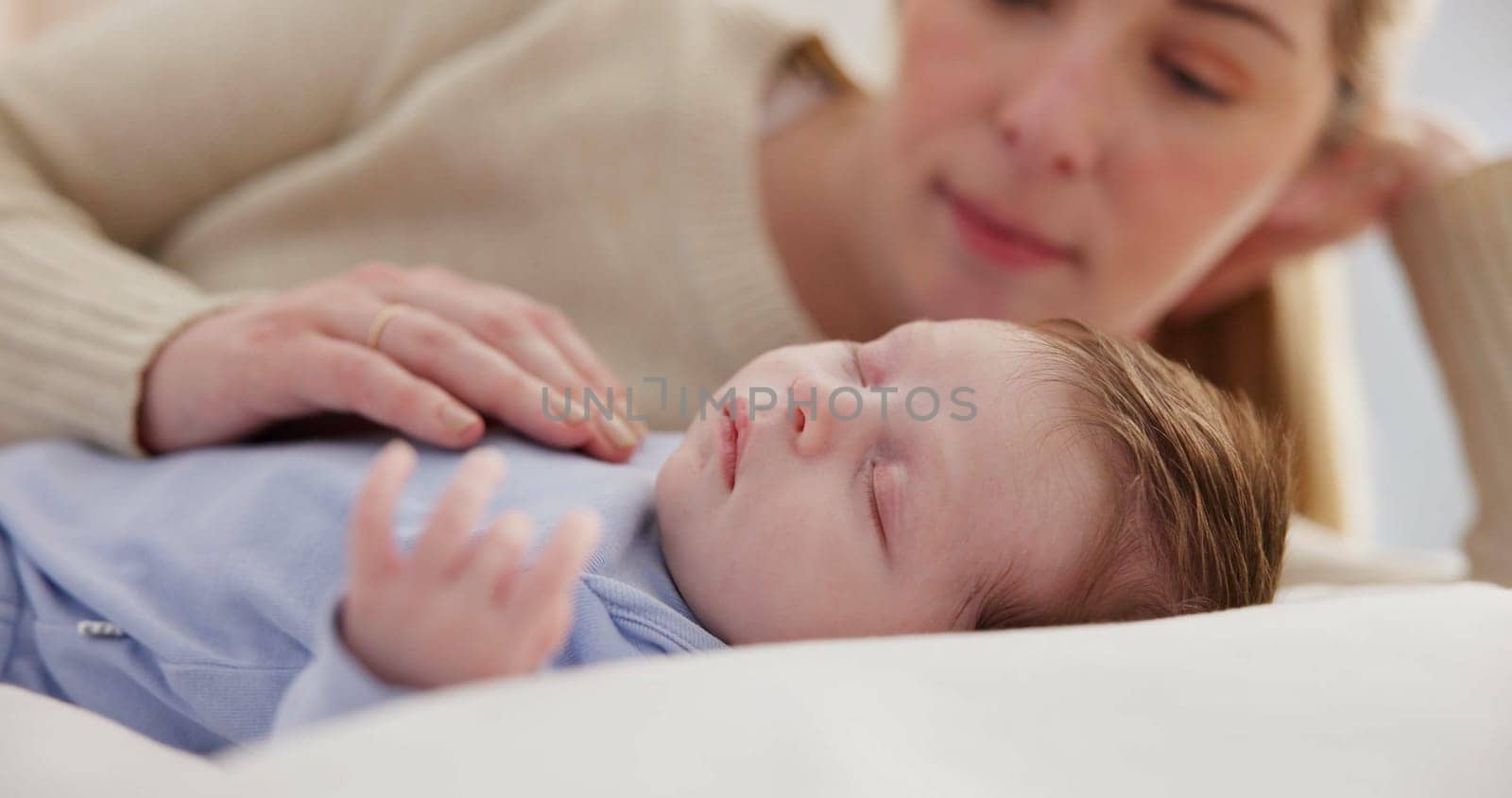 Family, love and a mama on the bed with her baby for sleep, rest or bonding together in a home. Children, bedroom and a single mom in an apartment with her newborn infant to relax for care or growth.
