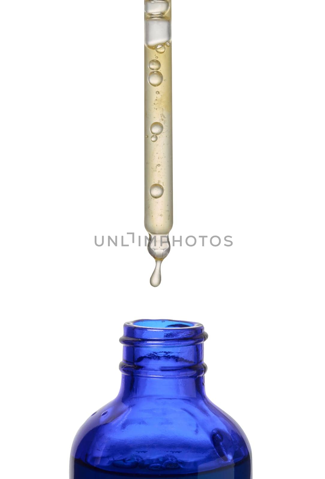 A glass blue bottle with a dropper on a white isolated background, a container for cosmetic products. 